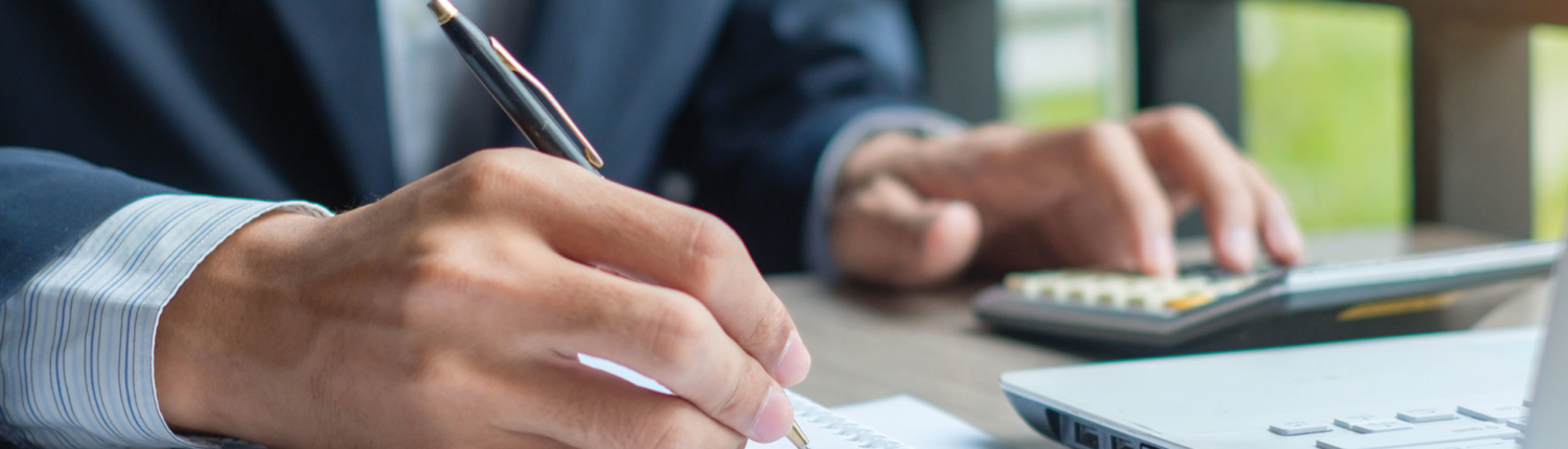 Financial-advisor-making-notes-of-stock-changes